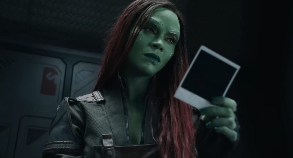 Gamora racting to a photo "Guardians of the Galaxy" Volume 3. 
