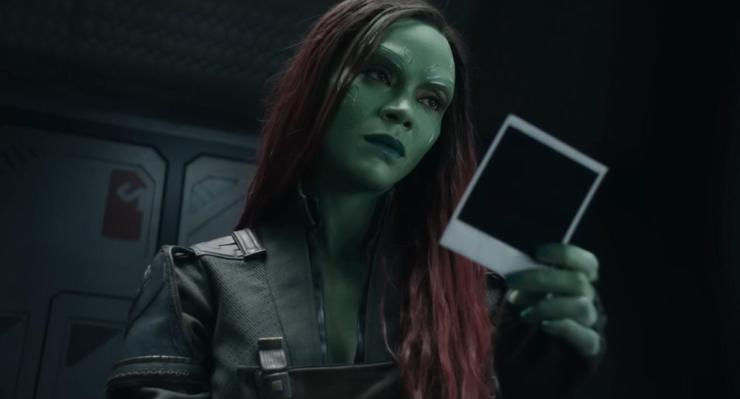 Gamora racting to a photo "Guardians of the Galaxy" Volume 3. 