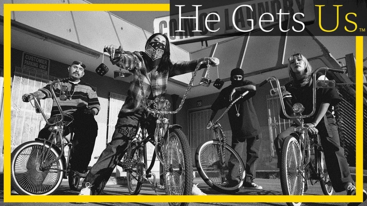 A group of Latinx people on bikes with overlaid text reading "He gets us."