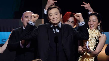 Brian Le, James Hong, Andy Le, and Michelle Yeoh accept the Outstanding Performance by a Cast in a Motion Picture award for 