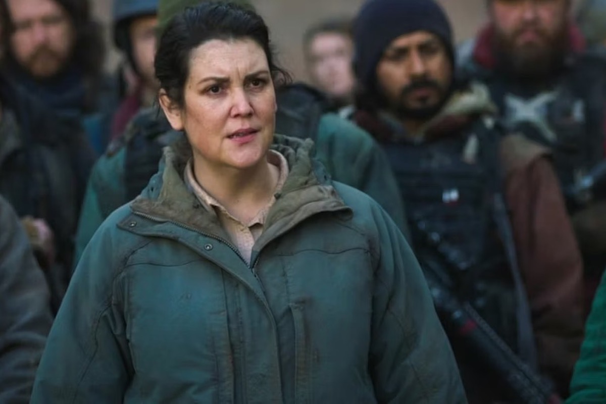 Melanie Lynskey in a scene from The Last of Us: a white woman wearing a thick coat stares indignantly.