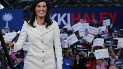 Nikki Haley grins in front of a crown of supporters.