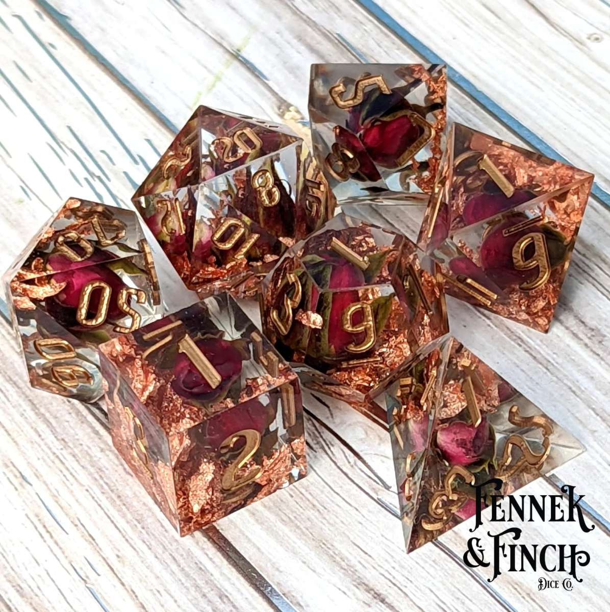 Clear dice with copper foil and rose petals inside