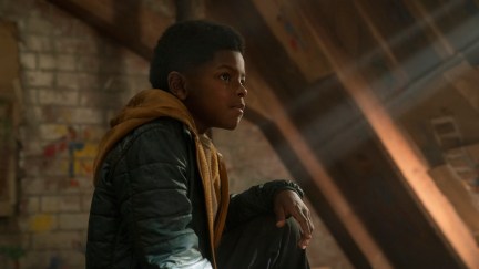 Sam sits in his attic hideout in The Last of Us.