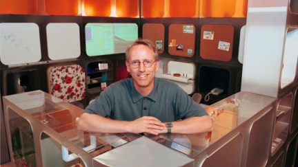 Scott Adams, famed creator of the comic strip DILBERT stands within 