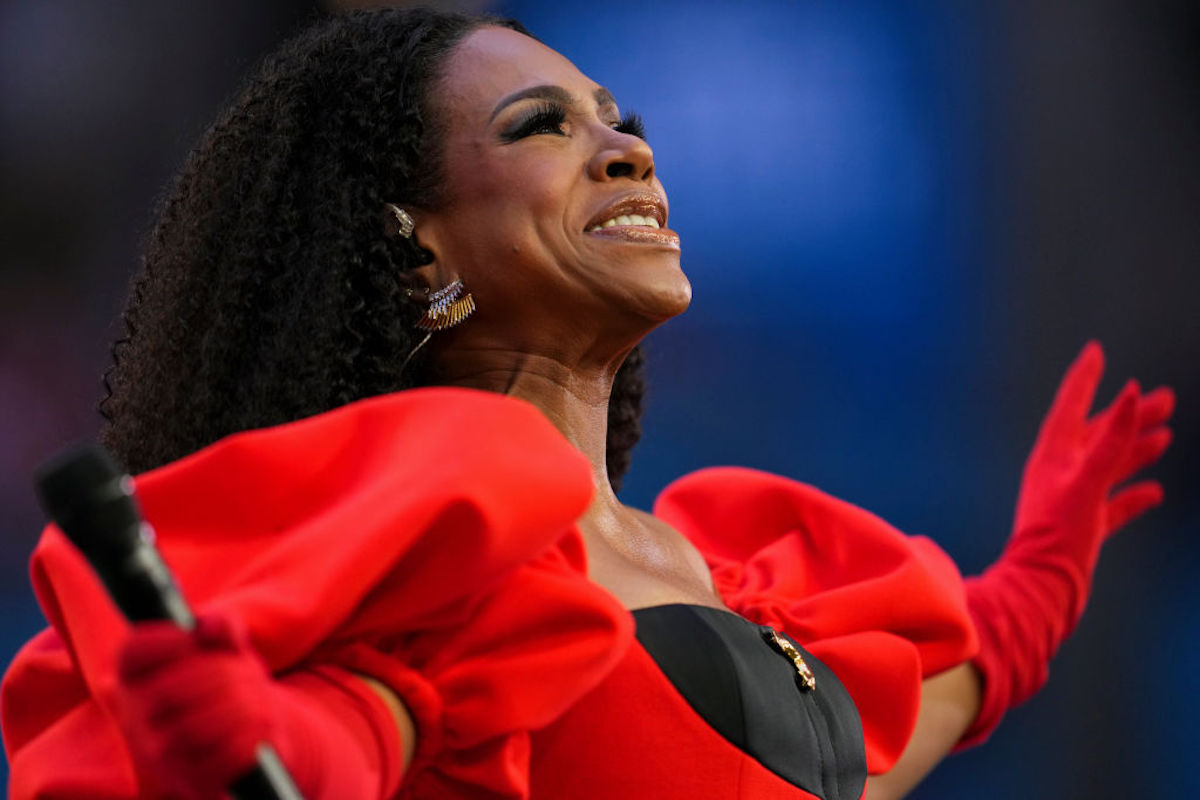 Sheryl Lee Ralph performs in a red gown.