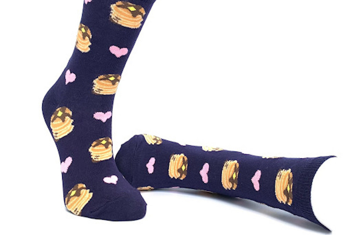 Blue socks with a pattern of pancakes and hearts