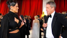 Ashley Graham and Hugh Grant talking during Countdown to the Oscars