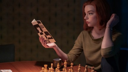 Beth Harmon studies up on her chess skills.