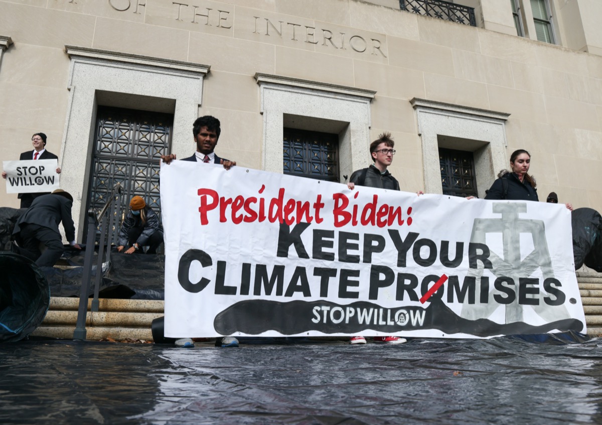 Climate activists hold a demonstration to urge President Biden to reject the Willow Project at the US Department of Interior on November 17, 2022 in Washington, DC.
