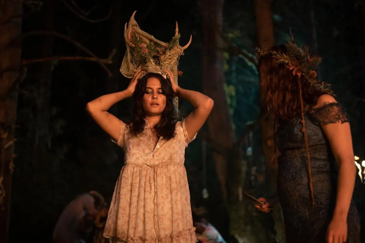 Lottie (Courtney Eaton) places an antler veil atop her head in 'Yellowjackets'