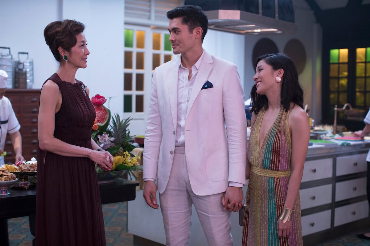 Michelle Yeoh, from left, Henry Golding and Constance Wu appear in a scene from the film Crazy Rich Asians
