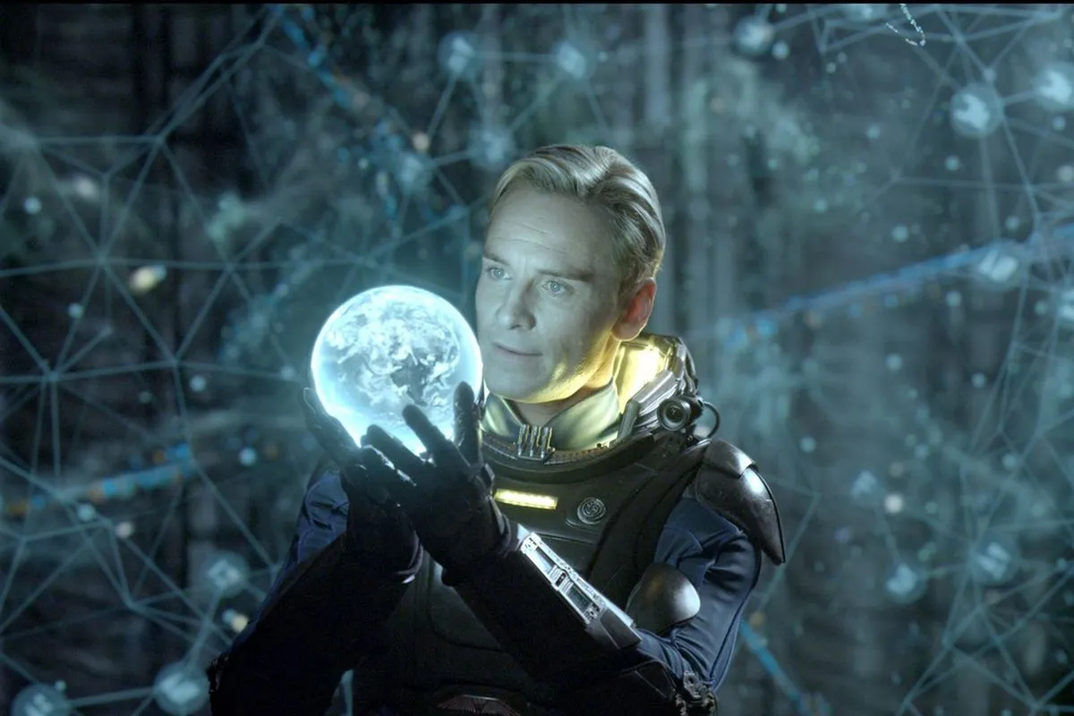 David (Michael Fassbender) holds a glowing orb in his hands in 'Prometheus'