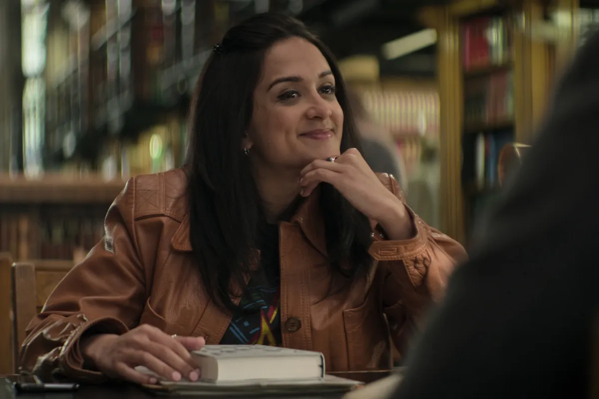 Nadia smiling in the library in You season 4