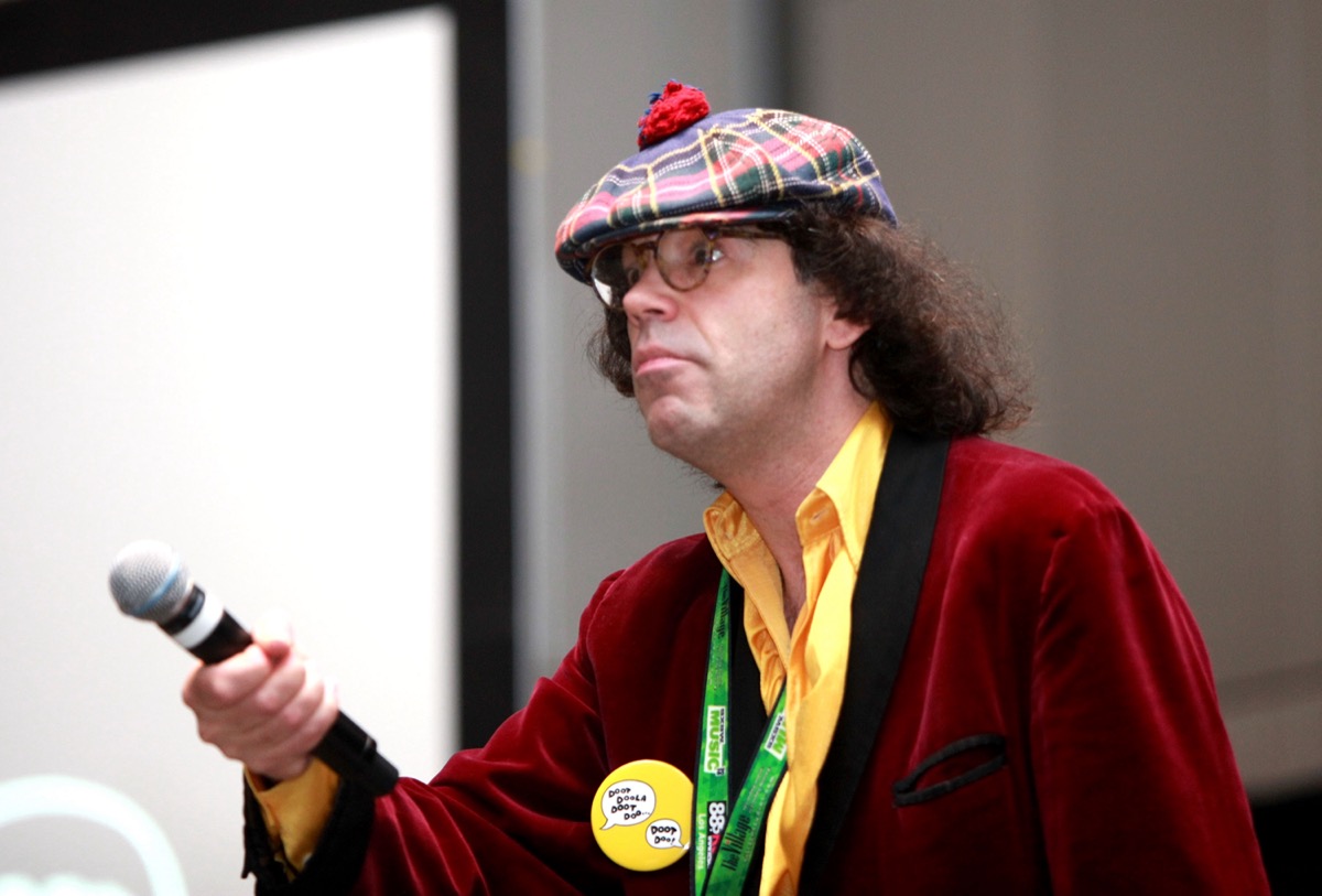Nardwuar the Human Serviette speaks onstage at 'Nardwuar's Video Vault'.