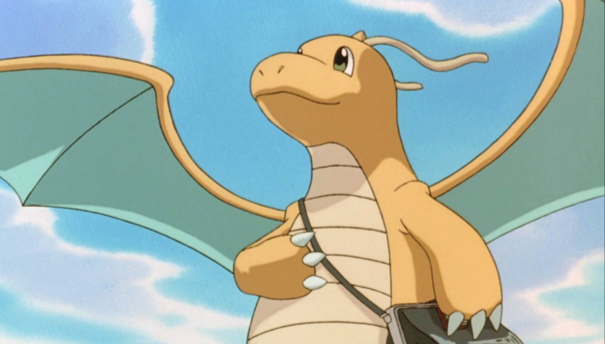Pokemon Dragonite looks to the sky with spread wings.