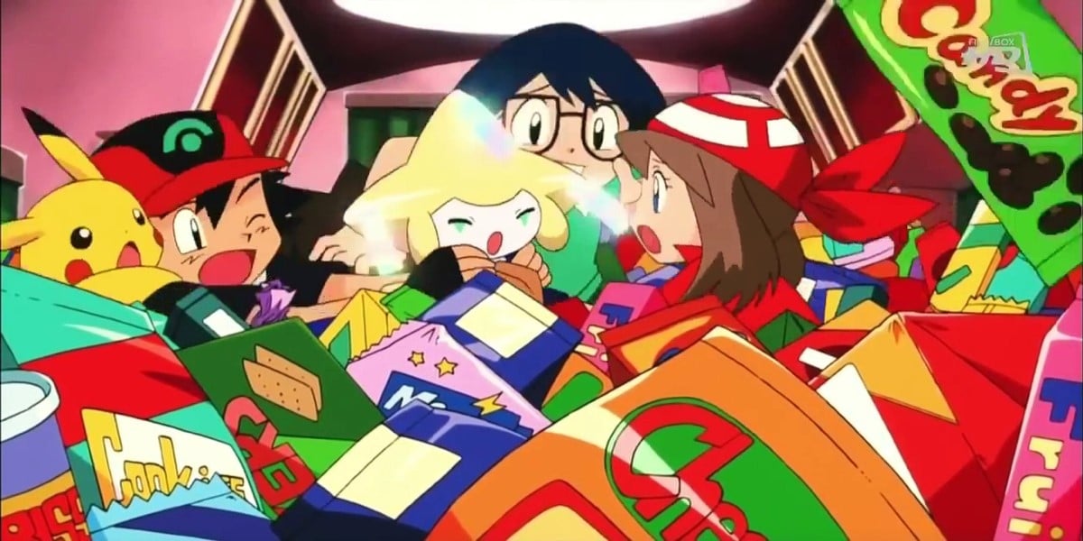 Screenshot from Pokémon Jirachi Wish-Maker, Ash, Pikachu, Max, May, and Jirachi underneath a pile of boxes