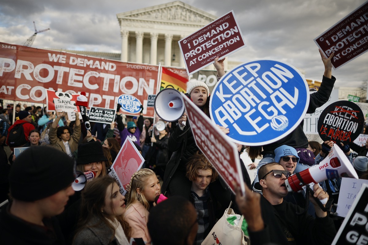 Anti-abortion and abortion rights activists protest during the 50th annual March for Life rally in front of the U.S. Supreme Court on January 20, 2023 in Washington, DC.