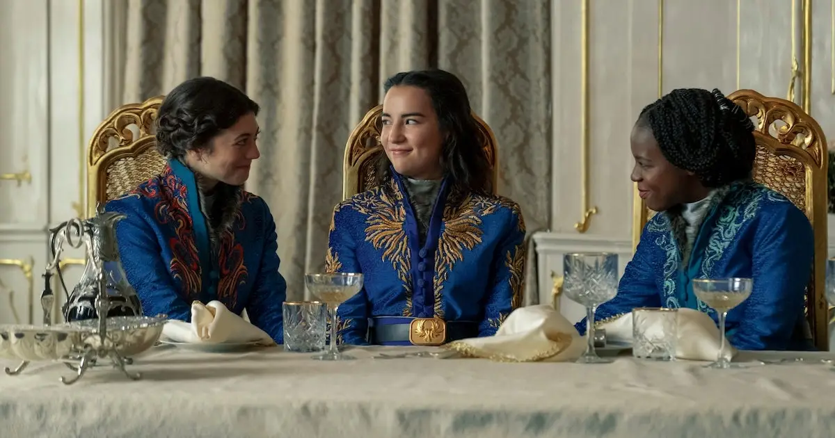 Alina Starkov, played by Jessie Mei Li, sits with her friends Nadia and Maria at the Little Palace in Shadow and Bone