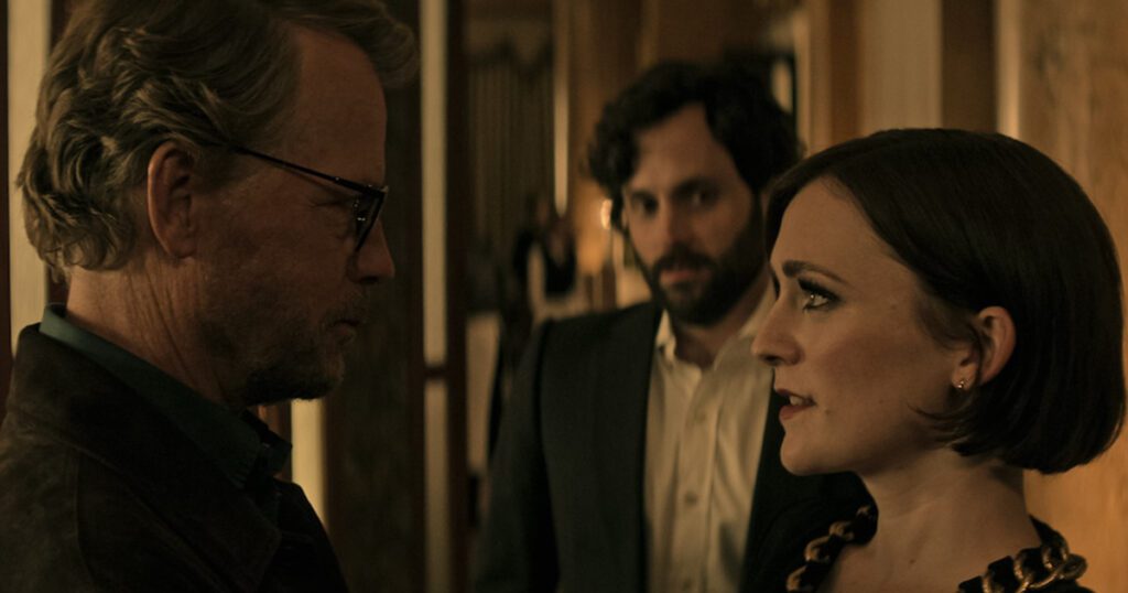 Tom looking at his daughter, Kate while Joe is in the background in You Season 4 part 2