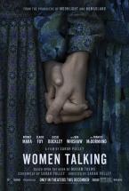 Women holding hands in the poster for "Women Talking." 