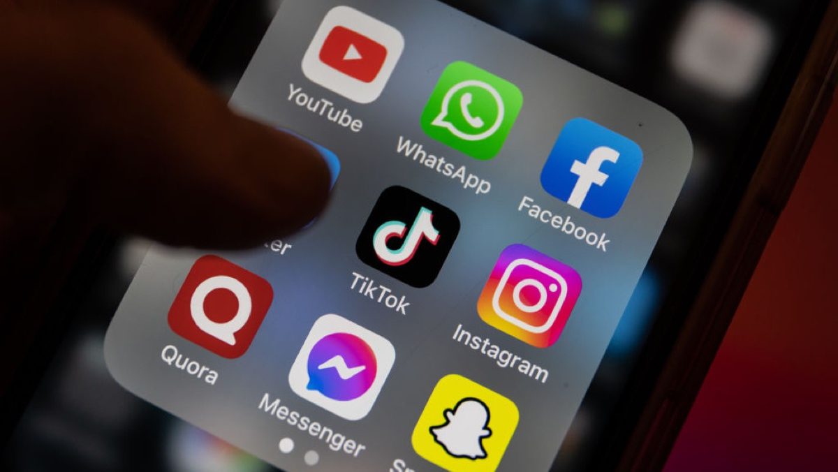 In this photo illustration the logo of Chinese online social media and video hosting service TikTok is displayed on a smartphone screen alongside that of that of YouTube, instant messaging software Whatsapp Facebook, Twitter, Instagram, Quora, Facebook Messenger and Snapchat.
