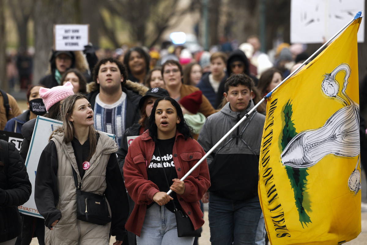 A group of abortion rights protesters marching.