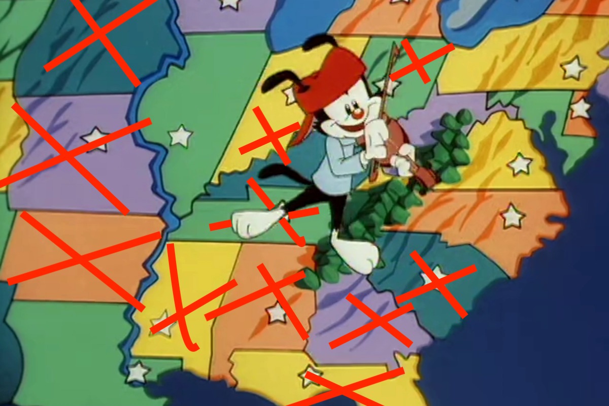 Animaniacs animated character Wakko dances across a map of the United States. A number of states have big red Xs drawn over them.