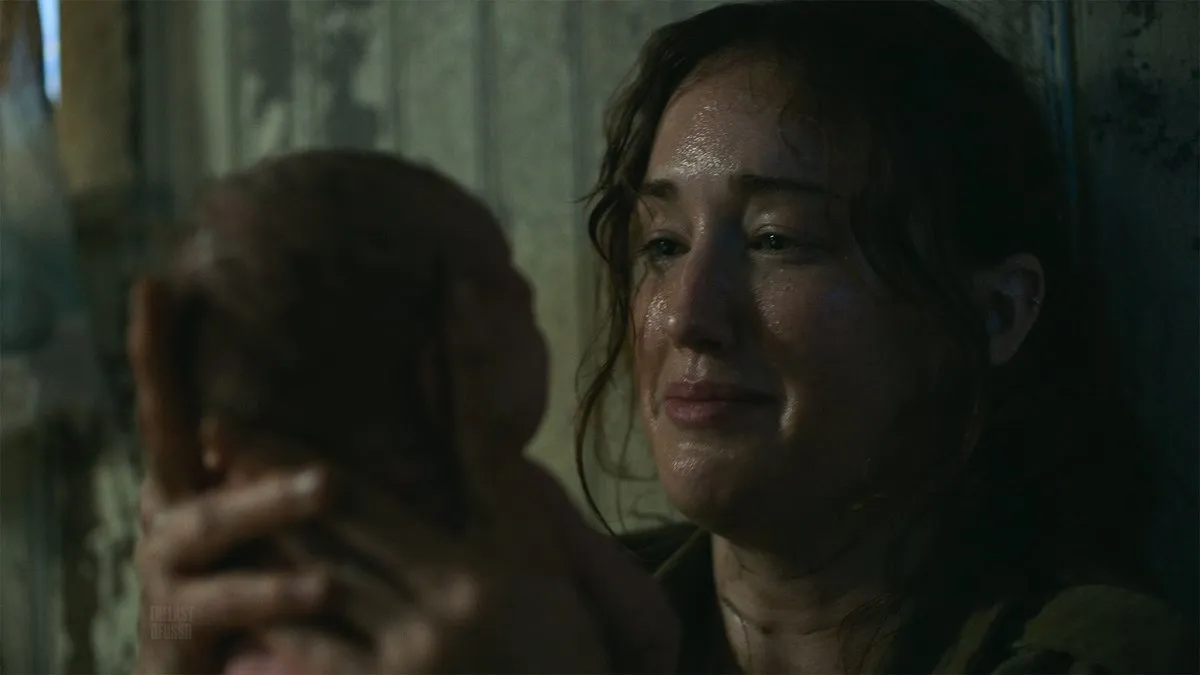 Anna holding her baby, Ellie, in HBO's The Last of Us.
