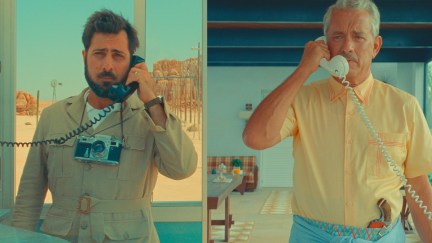 Two men (Jason Schwartzman and Tom Hanks) in split screen talking on phones with cords.