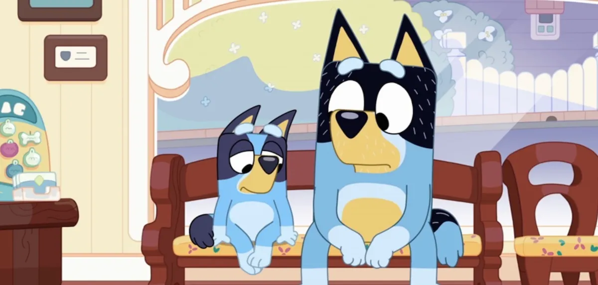 Bluey and Bandit sit in a waiting room, looking worried.