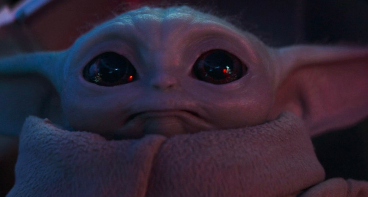 Grogu looking up to the stars while escaping the Empire in the Mandalorian