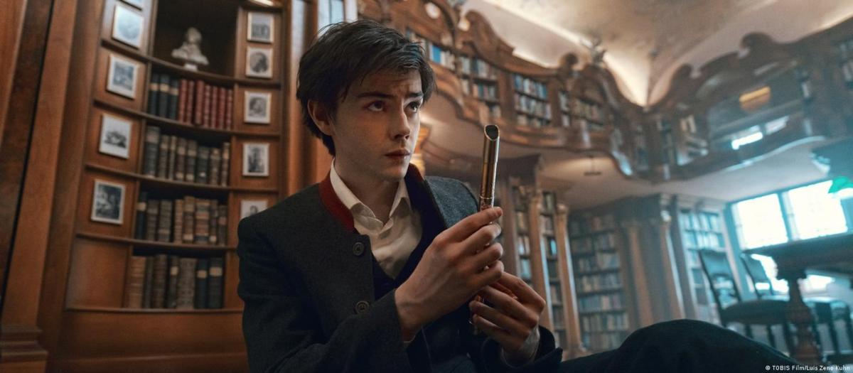 Jack Wolfe holding a flute in the Magic Flute