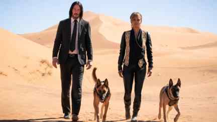 John Wick (Keanu Reeves) and Sofia Al-Azwar (Halle Berry) walking in a desert in 'John Wick Chapter 3-Parabellum.'