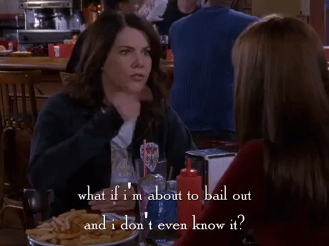 GIF from the WB show 'Gilmore Girls.' Lorelei (played by Lauren Graham) is at a table at a casual restaurant talking to someone across from her over food. She is a white woman with long, dark hair and is wearing a blue jacket over a white t-shirt. She's saying "what if I'm about to bail out and I don't even know it?" The words appear as text in the 'Gilmore Girls' font at the bottom of the GIF.