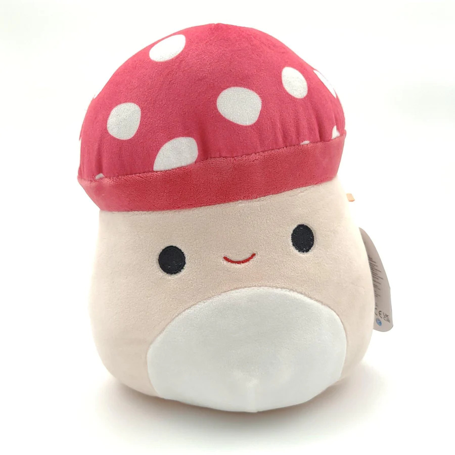 A beige mushroom with a happy smile and a white spotted red cap