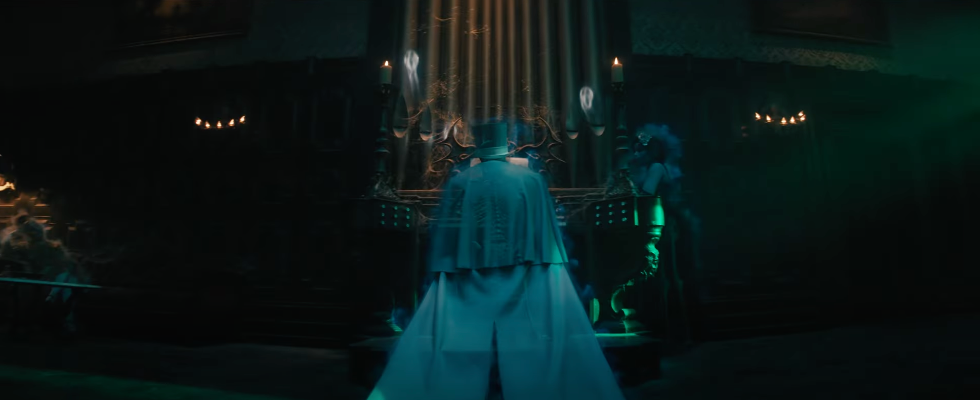 A still of the organist in the ballroom from the haunted mansion trailer