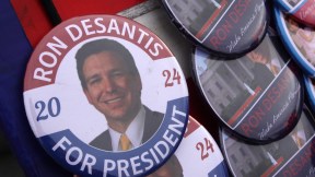 A button featuring Ron DeSantis' face and the words 