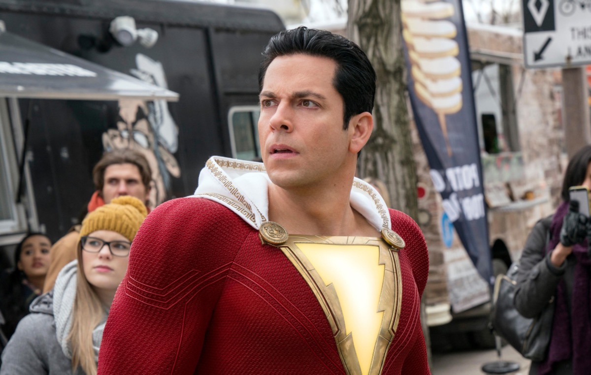 Zachary Levi looking confused in his superhero outfit in Shazam 2.