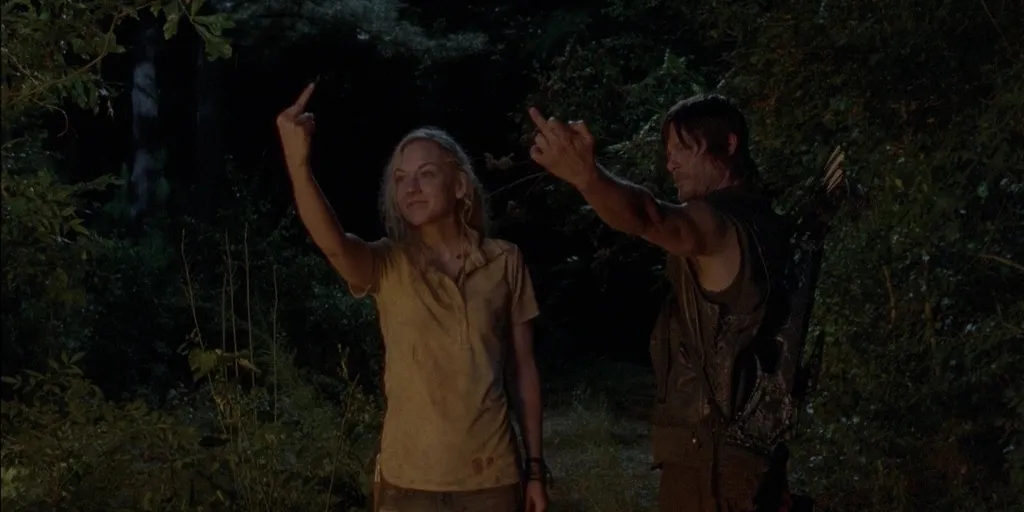 Beth and Daryl holding up their middle fingers like icons in The Walking Dead season 4