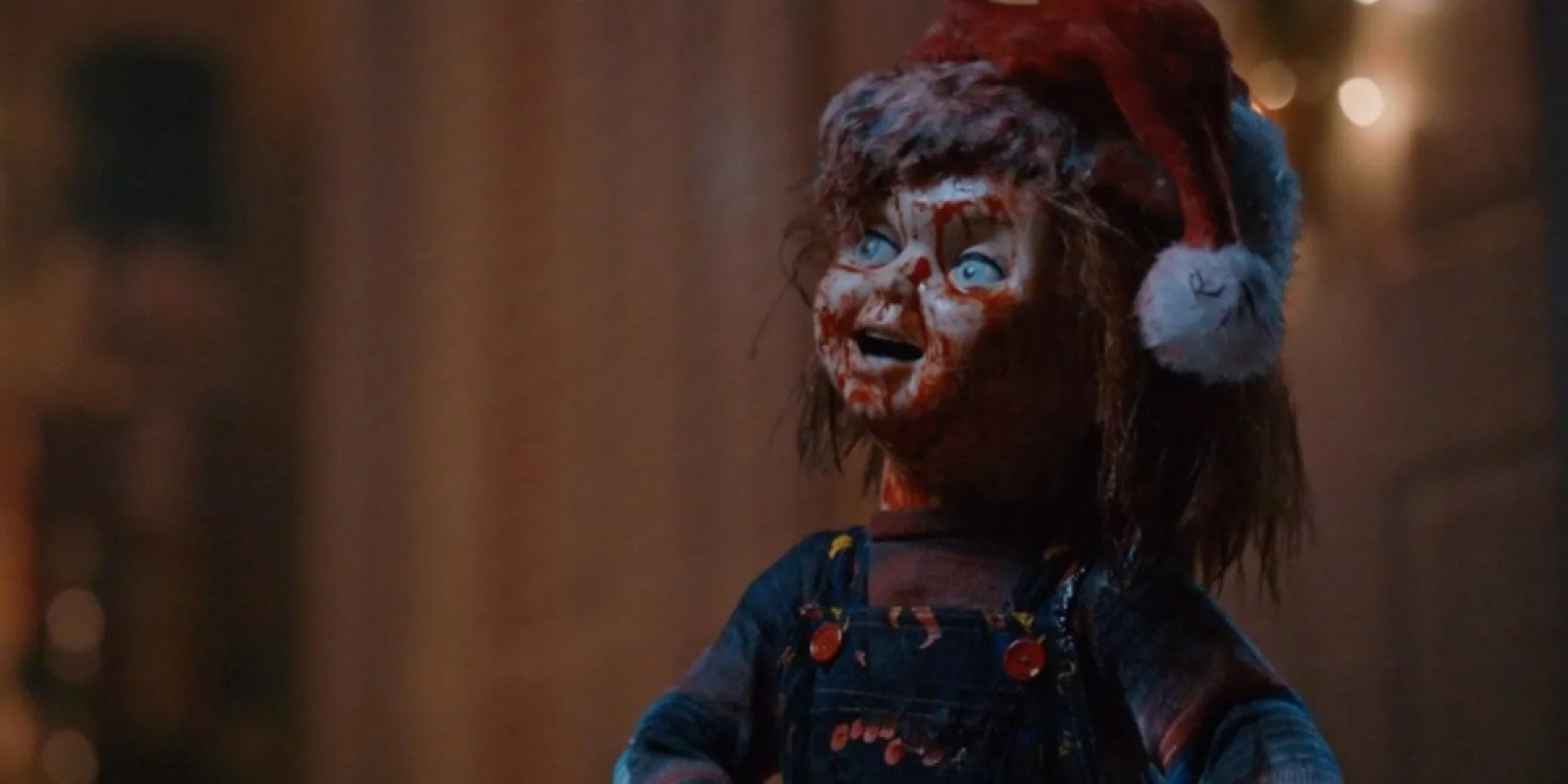Chucky wearing a Santa hat while covered in blood in Chucky season 2