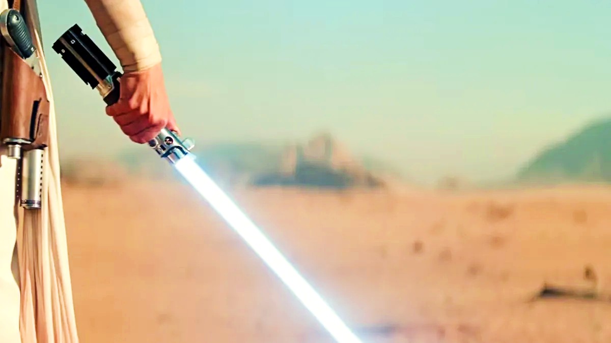 Daisy Ridley as Rey holding a lightsaber in Star Wars: Rise of Skywalker