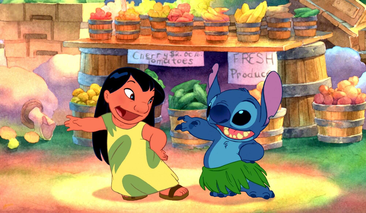 Lilo and Stitch dance in front of a fruit stand in 'Lilo & Stitch'