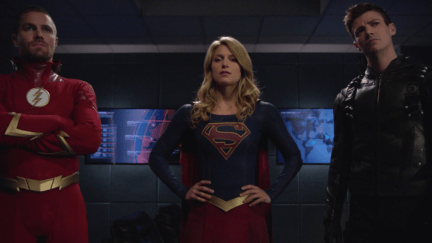 The Flash, Green Arrow, and Supergirl stand together