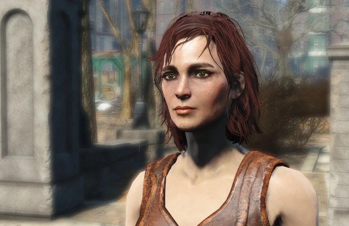 Cait standing outside wearing a brown top (Bethesda)