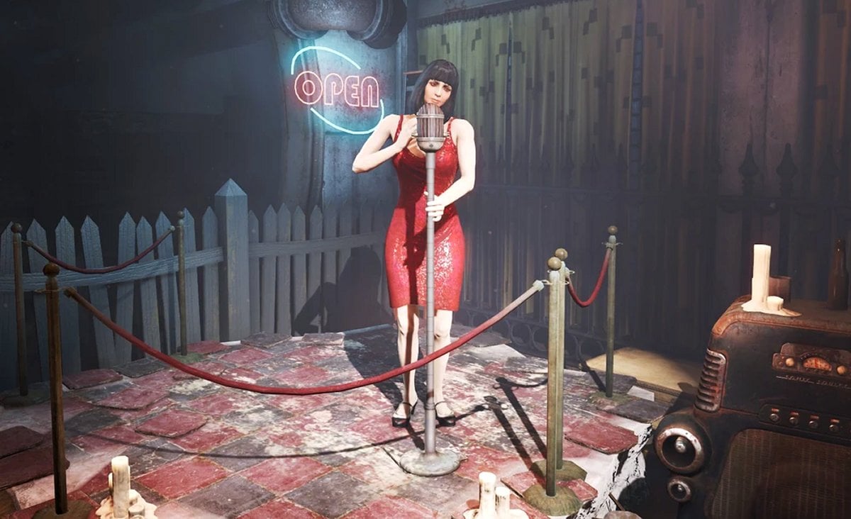 Magnolia on stage wearing a red dress (Bethesda)