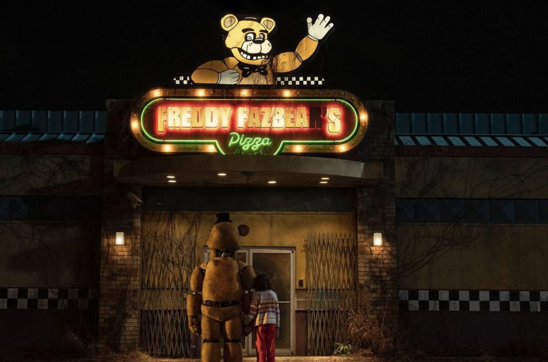 Freddy and a kid outside of Freddy Fazbear's pizza