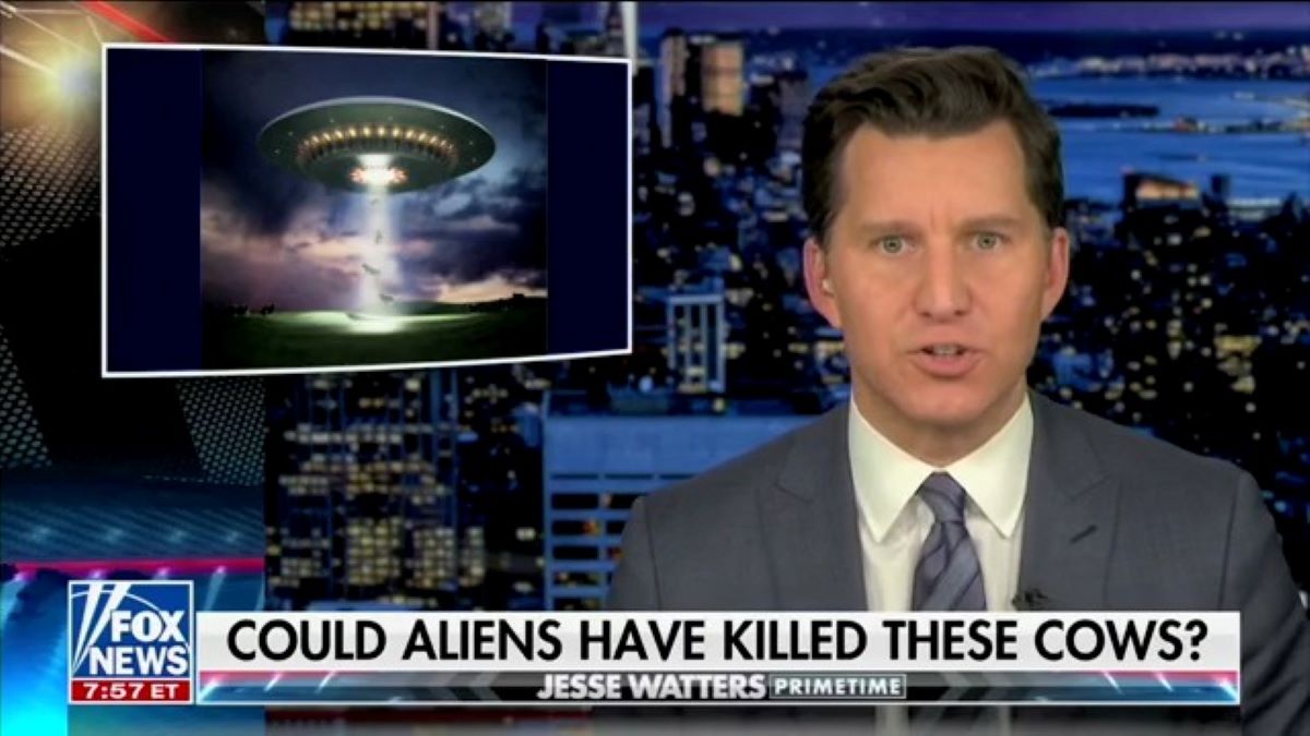 A screengrab from Fox News host Jesse Watters's show with a graphic of a UFO and a chyron that reads, "Could Aliens Have Killed These Cows?"