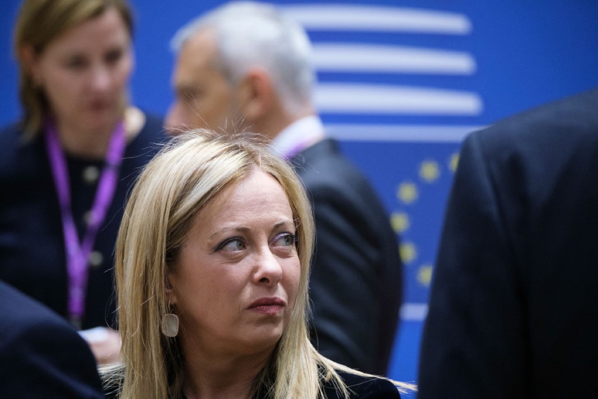 Italian Prime Minister Giorgia Meloni attends a two days EU Summit in the Europa, the EU Council headquarter on March 23, 2023 in Brussels, Belgium. She's looking to the side with a disgruntled expression.