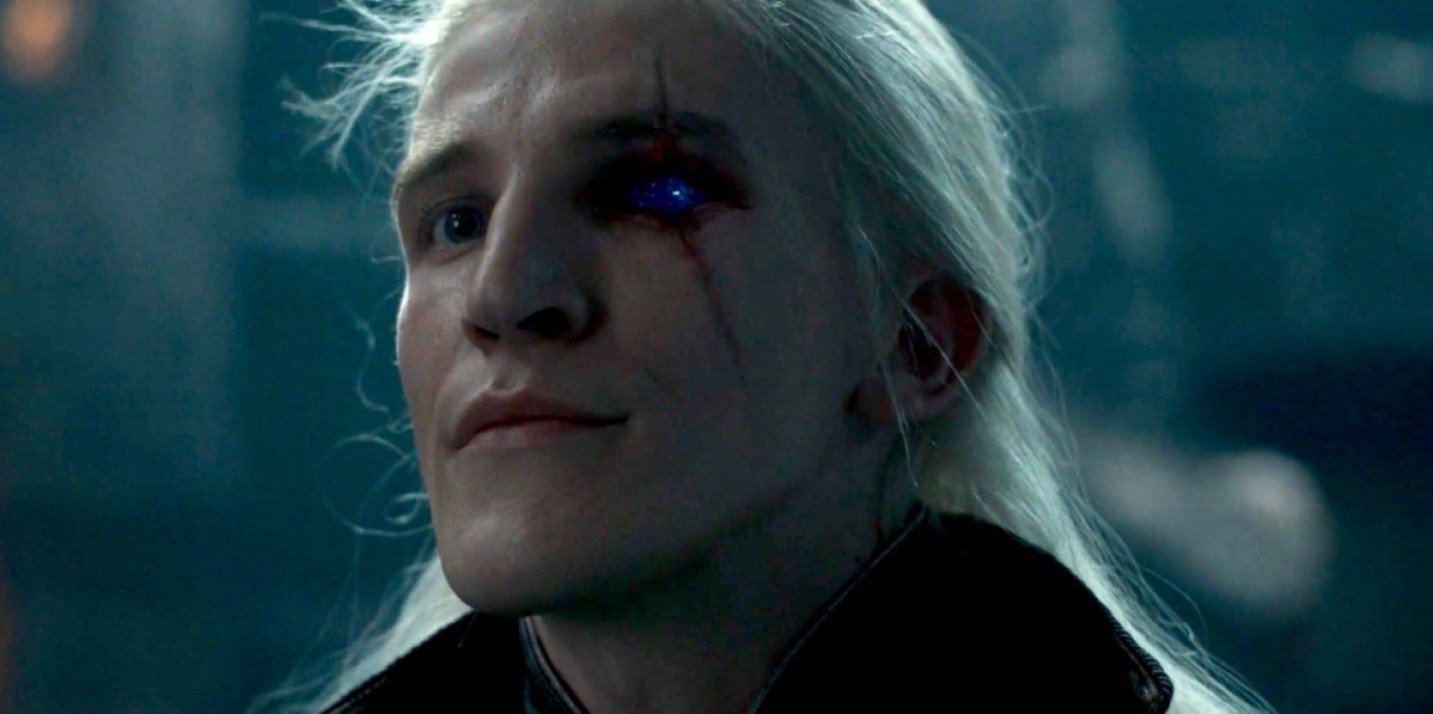 A picture of Aemond Targaryen, played by Ewan Mitchell, revealing his famous sapphire eye in House of the Dragon